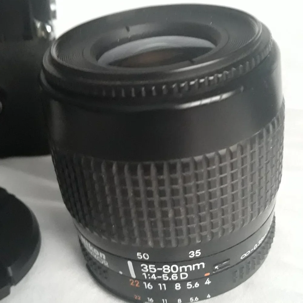 Nikon Nikkomat EL Nikkor 35-80mm 4-5.6D Zoom lens. Leather case
